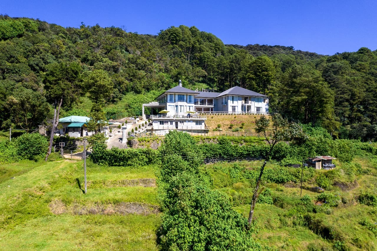 Golden hour view of Nuwara Eliya valley and winding roads