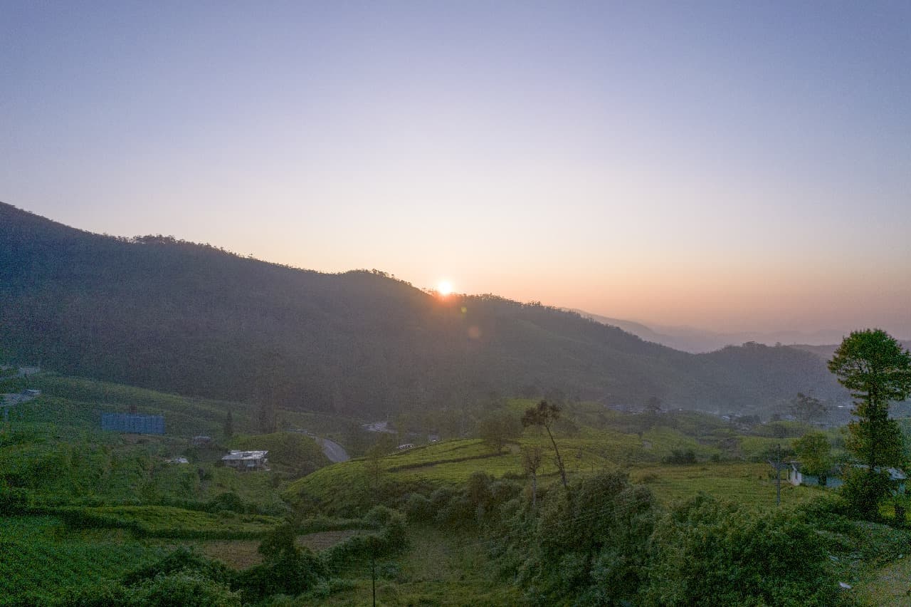 Hotel front facade with stone terraces and landscaping